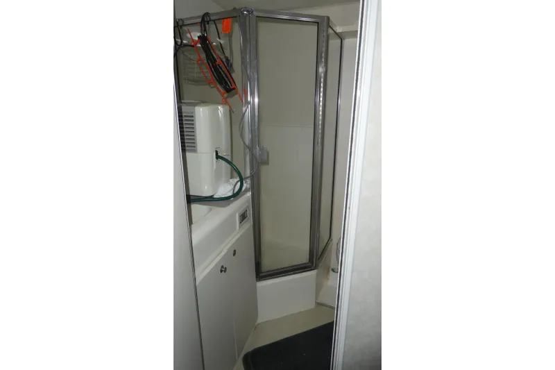 Slide: The Image of Bathroom interior of 1997 Silverton 41 Convertible yacht with shower and storage. - 15