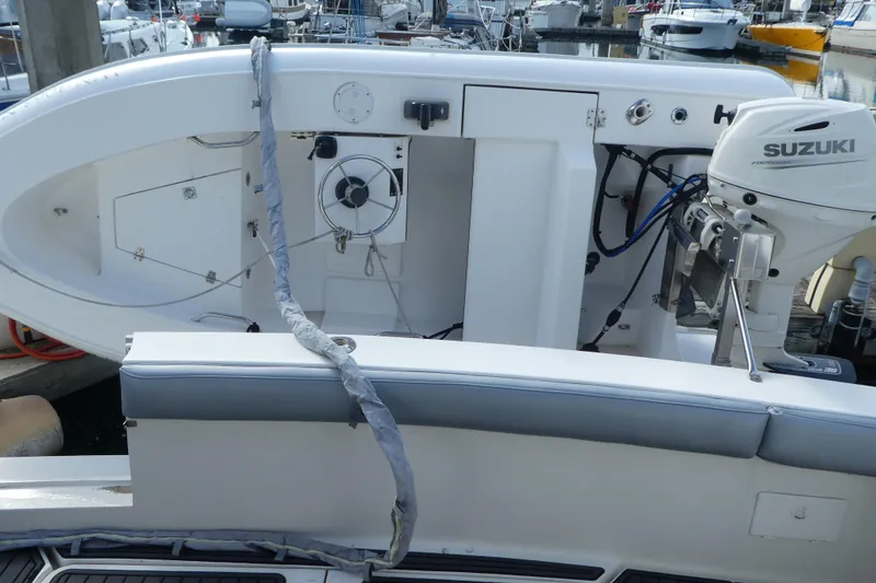 Slide: The Image of 1997 Silverton 41 Convertible boat with Suzuki outboard motor at marina. - 36