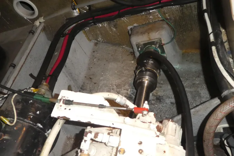 Slide: The Image of Engine compartment of a 1997 Silverton 41 Convertible boat, showing mechanical components and wiring. - 30