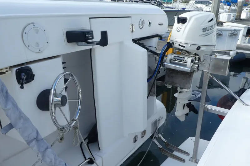 Slide: The Image of 1997 Silverton 41 Convertible boat with Suzuki outboard motor at dock. - 44