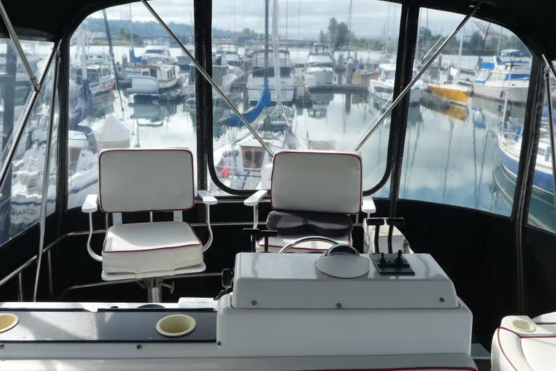 Slide: The Image of Interior view of 1997 Silverton 41 Convertible yacht at marina. - 38