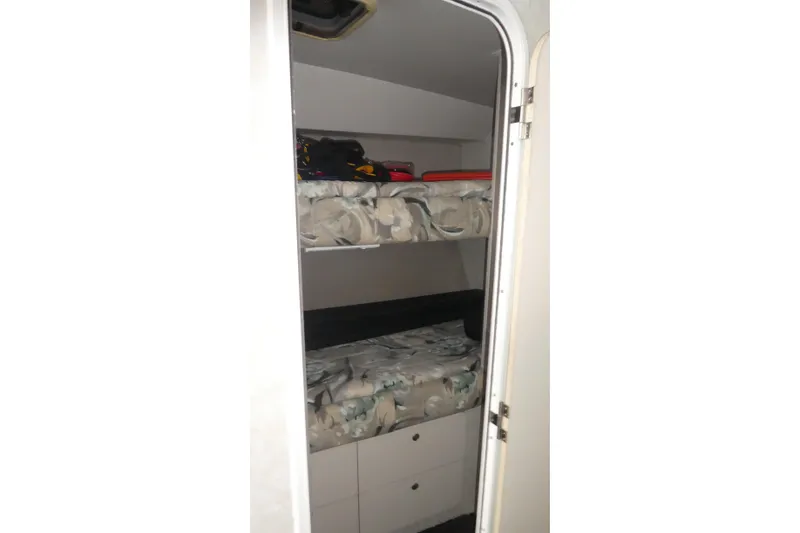 Slide: The Image of Interior cabin of 1997 Silverton 41 Convertible with bunk beds and storage. - 18
