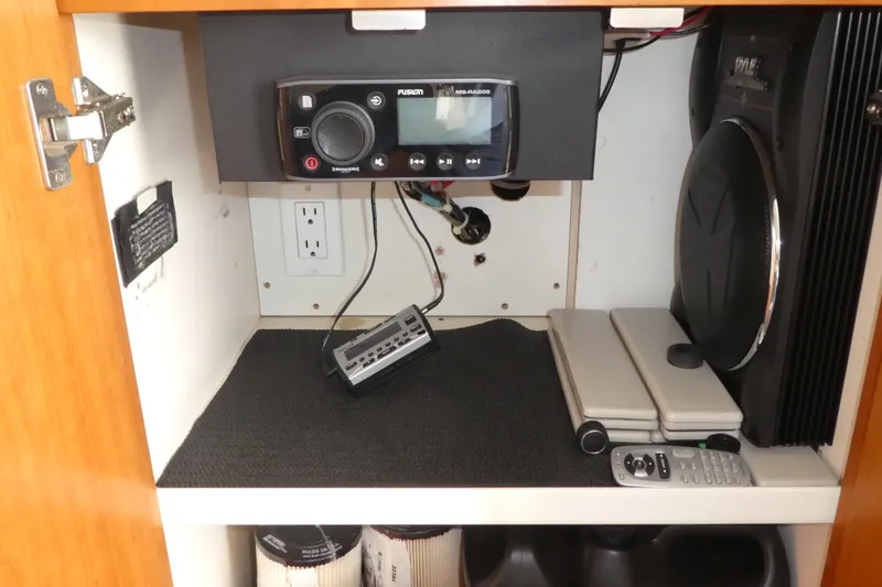 Slide: The Image of Interior electronics setup in a 1997 Silverton 41 Convertible boat cabinet. - 21