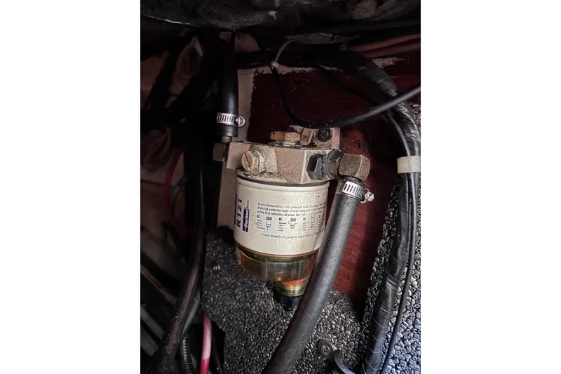 Slide: The Image of Fuel filter system in a 1984 Islander 28 boat engine compartment. - 17