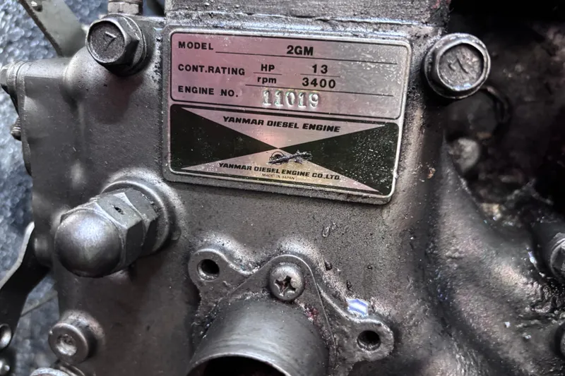 Slide: The Image of Yanmar diesel engine plate on 1984 Islander 28, model 2GM, 13 HP, 3400 RPM. - 16