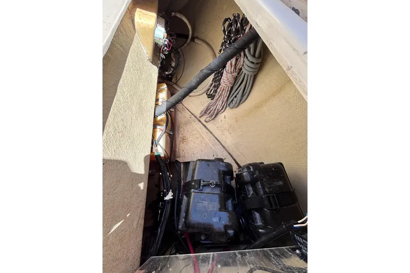 Slide: The Image of Interior view of 1984 Islander 28 sailboat showing battery compartment and coiled ropes. - 30