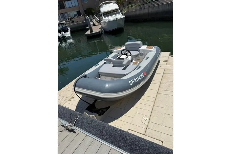 Slide: The Image of 2019 Williams Jet Tenders 285 Turbo Jet docked at a marina. - 3