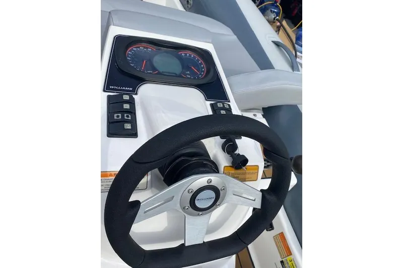 Slide: The Image of Steering wheel and dashboard of 2019 Williams Jet Tenders 285 Turbo Jet boat. - 8