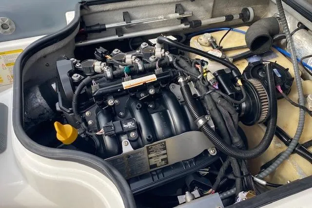 Slide: The Image of Engine of a 2019 Williams Jet Tenders 285 Turbo Jet, showcasing intricate components and wiring. - 6