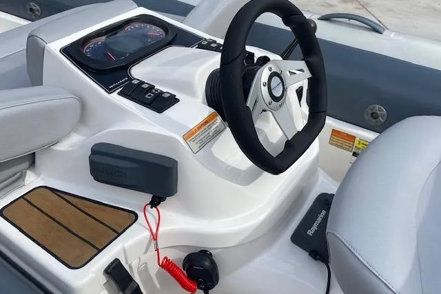 Slide: The Image of 2019 Williams Jet Tenders 285 Turbo Jet dashboard with steering wheel and controls. - 5