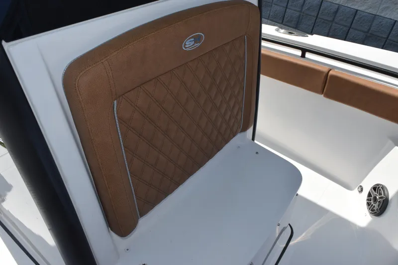 Slide: The Image of 2026 Sea Hunt Gamefish 25 boat seat with brown diamond-stitched upholstery. - 14
