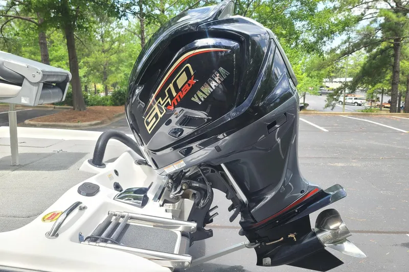 Slide: The Image of 2012 Bass Cat Cougar FTD with Yamaha VMAX outboard motor in a parking lot. - 4