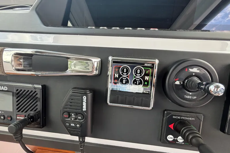 Slide: The Image of Control panel of a 2021 Axopar 28 Cabin boat with Simrad equipment. - 21