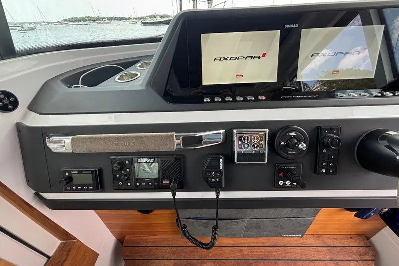 Slide: The Image of Control panel of a 2021 Axopar 28 Cabin boat with navigation equipment. - 13