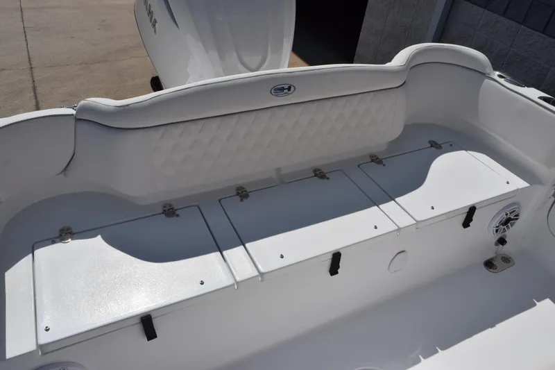 Slide: The Image of 2027 Sea Hunt Ultra 255 SE boat interior with storage compartments and seating. - 8