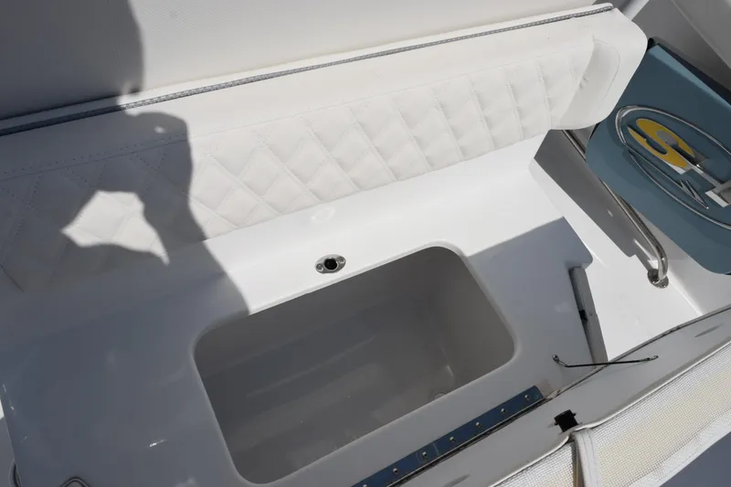 Slide: The Image of 2027 Sea Hunt Ultra 255 SE boat interior with storage compartment and seating. - 17
