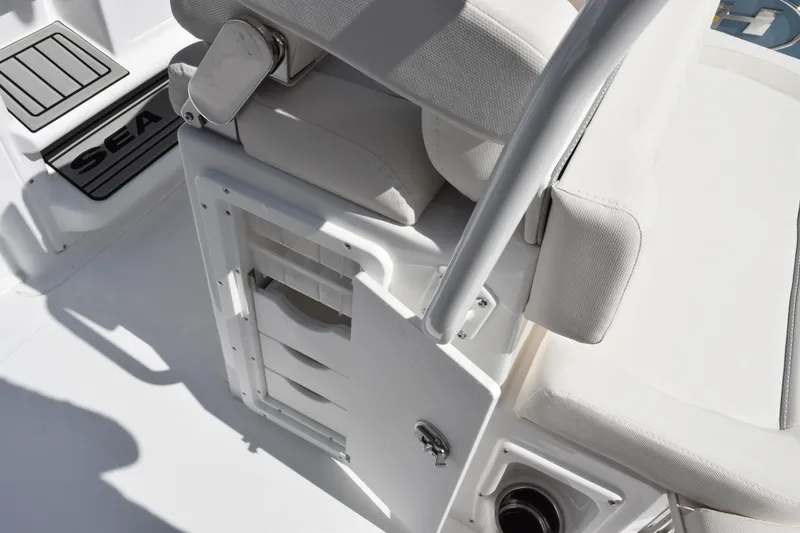 Slide: The Image of 2027 Sea Hunt Ultra 255 SE boat interior with storage compartment and seating. - 18