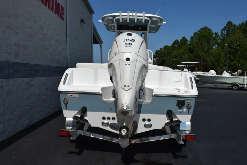 Slide: The Image of 2027 Sea Hunt Ultra 255 SE boat with powerful 350 V6 engine, parked outdoors. - 5