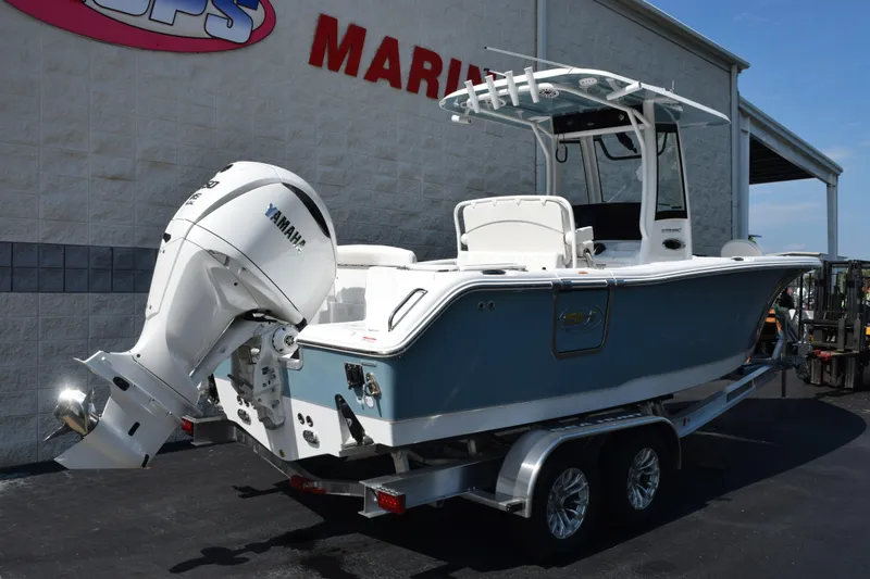Slide: The Image of 2027 Sea Hunt Ultra 255 SE boat with Yamaha engine on trailer at marina. - 4