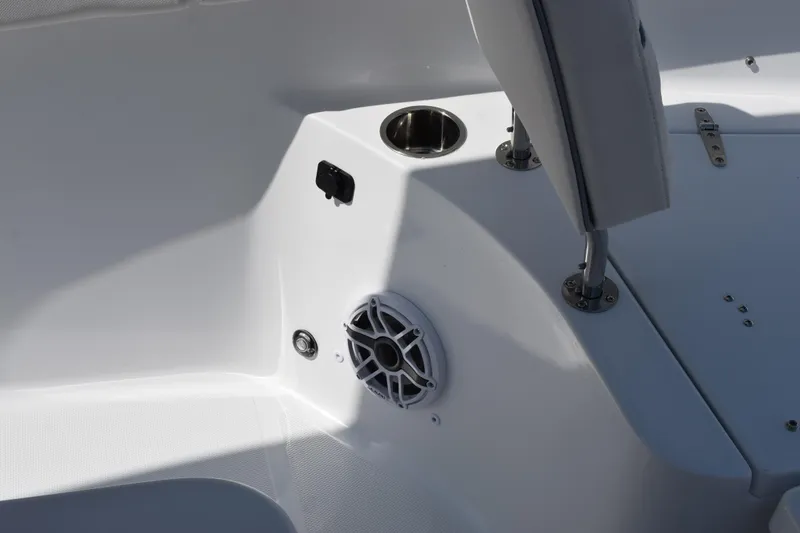 Slide: The Image of Interior detail of 2027 Sea Hunt Ultra 255 SE boat, featuring speaker and seating area. - 14