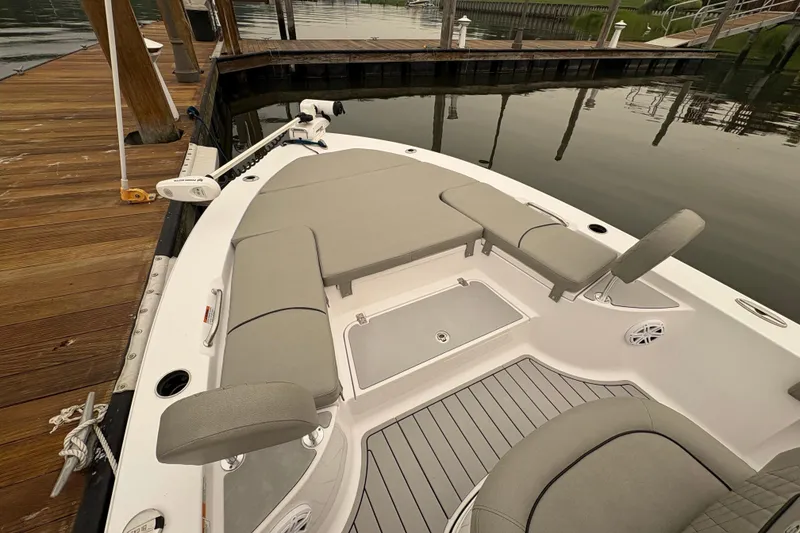 Slide: The Image of 2023 Sportsman Masters 227 Bay Boat docked, featuring spacious seating and sleek design. - 9
