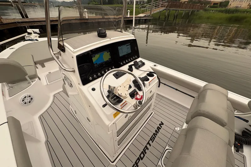 Slide: The Image of 2023 Sportsman Masters 227 Bay Boat cockpit with advanced navigation system and comfortable seating. - 6