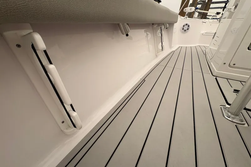 Slide: The Image of 2023 Sportsman Masters 227 Bay Boat interior with sleek, modern deck design. - 18