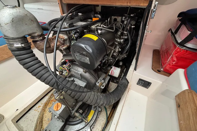 Slide: The Image of Engine compartment of a 2006 J Boats J/100 sailboat, showcasing detailed mechanical components. - 37