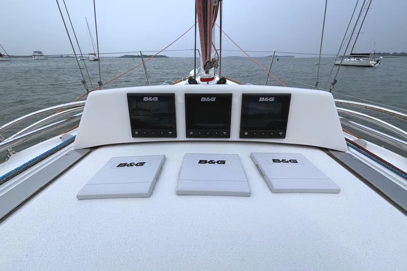 Slide: The Image of The image shows the cockpit of a J/100 sailboat with multiple B&G instruments. - 22