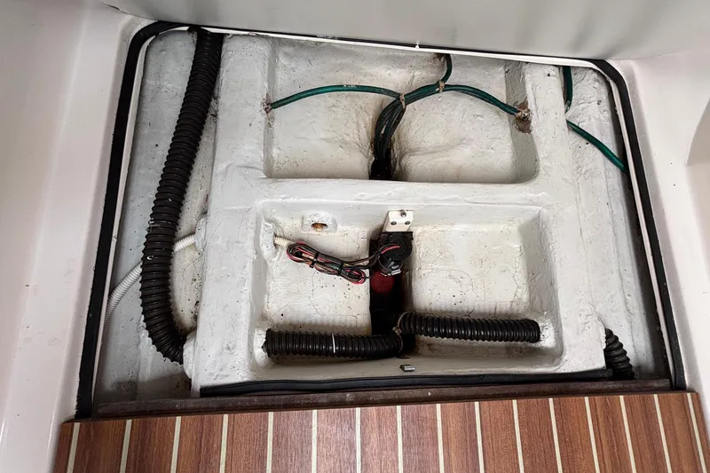 Slide: The Image of Interior view of a 2006 J Boats J/100 sailboat, showcasing wiring and structural components. - 39
