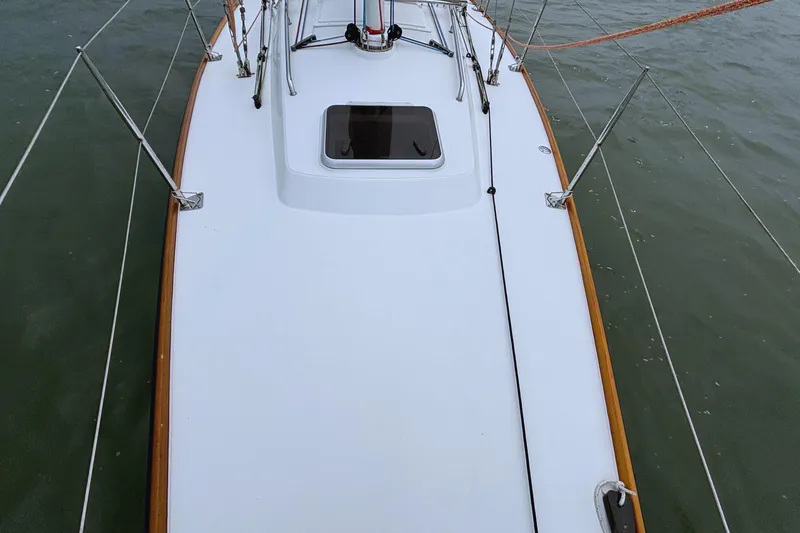 Slide: The Image of 2006 J Boats J/100 sailboat deck view, featuring sleek design and sturdy rigging. - 18