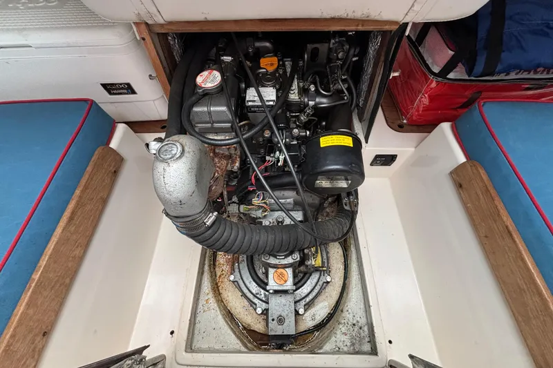 Slide: The Image of Engine compartment of a 2006 J Boats J/100 sailboat, showcasing mechanical components. - 36
