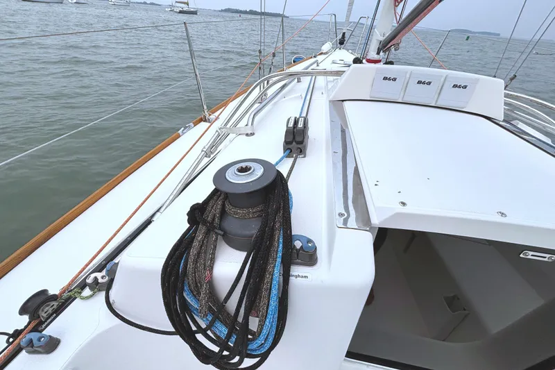 Slide: The Image of The image shows the deck of a 2006 J Boats J/100 with sailing equipment. - 19