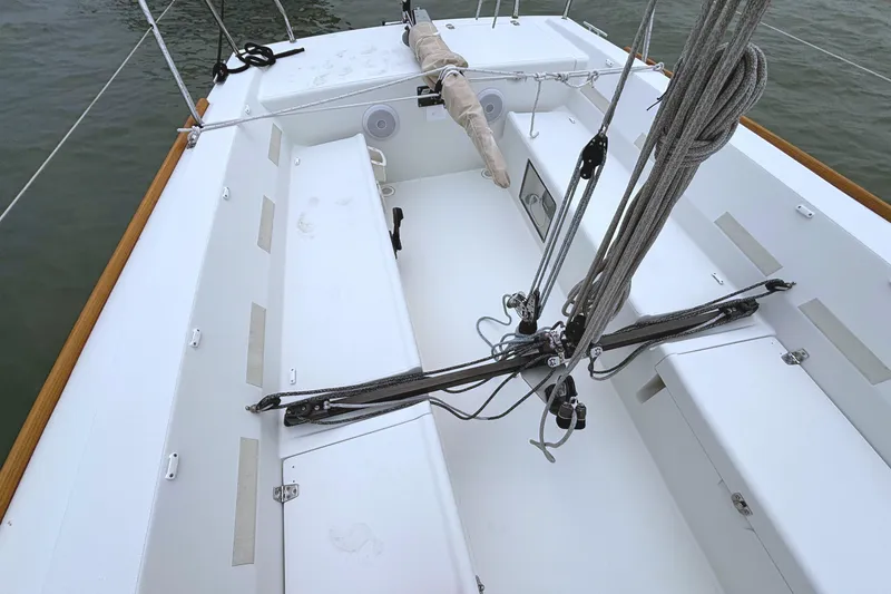 Slide: The Image of The image shows the cockpit of a 2006 J Boats J/100 with a clean, white deck. - 16