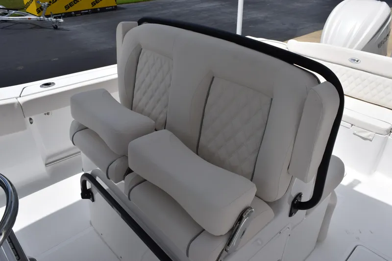 Slide: The Image of 2027 Sea Hunt Ultra 275 SE boat with luxurious white seating and armrests. - 10