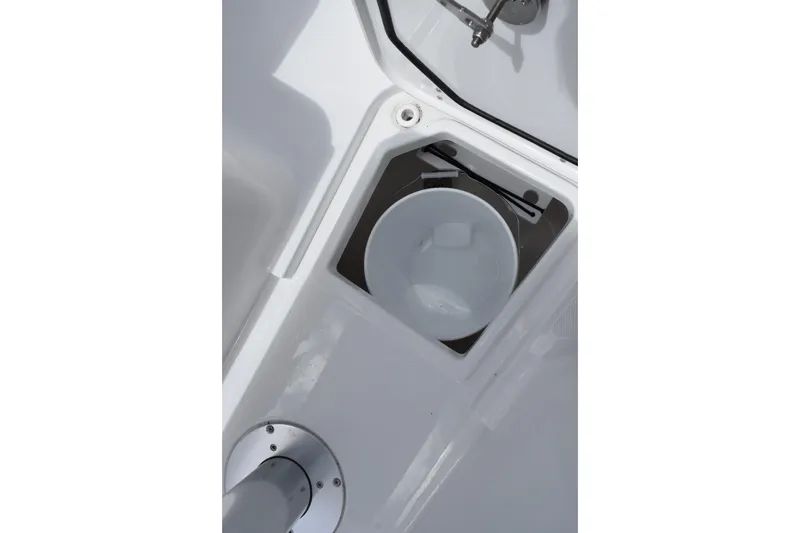 Slide: The Image of Storage compartment with bucket on 2027 Sea Hunt Ultra 275 SE boat. - 18