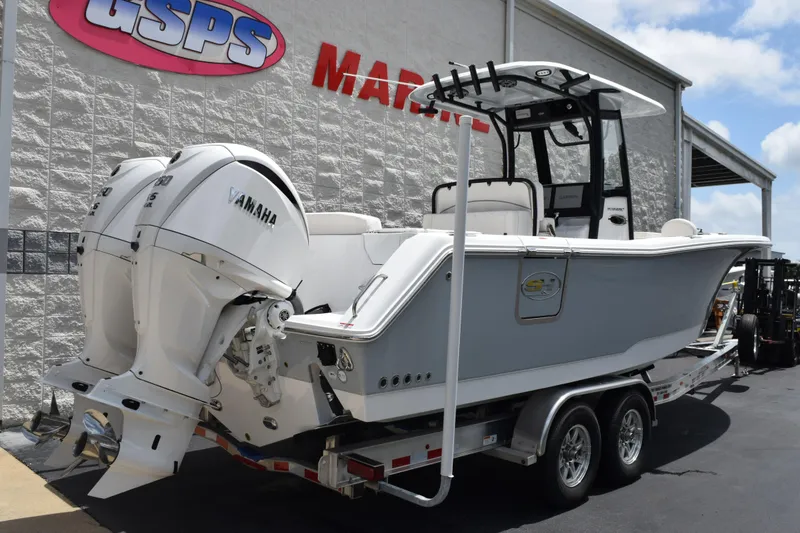 Slide: The Image of 2027 Sea Hunt Ultra 275 SE boat with dual Yamaha engines on a trailer. - 3