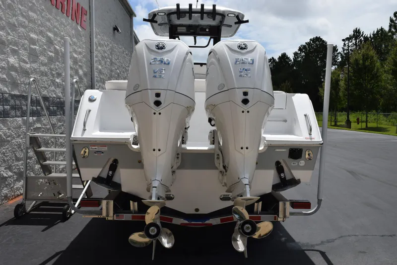 Slide: The Image of 2027 Sea Hunt Ultra 275 SE boat with dual Yamaha 250 V6 engines, rear view. - 4