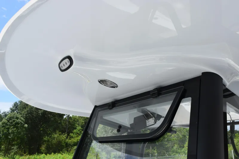 Slide: The Image of 2027 Sea Hunt Ultra 275 SE boat canopy and window detail, showcasing sleek design. - 13