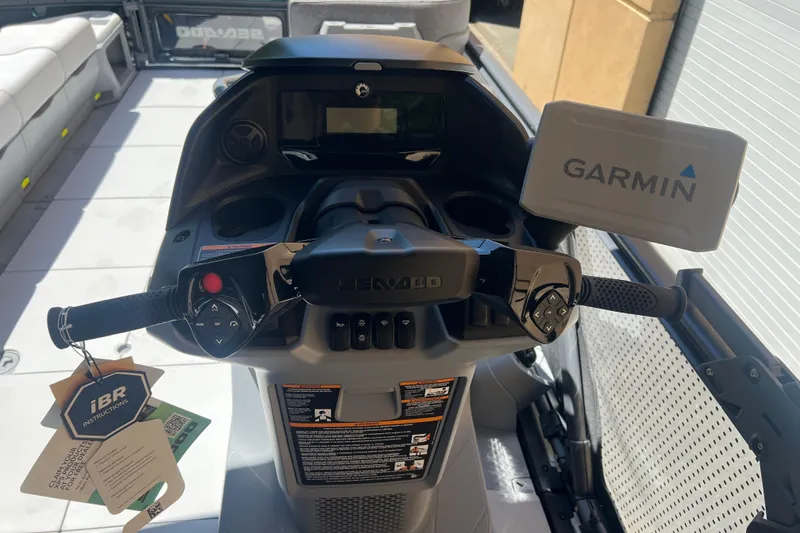 Slide: The Image of 2026 Sea-Doo Switch Cruise 21 dashboard with Garmin navigation system and iBR controls. - 15