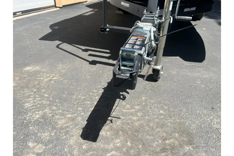 Slide: The Image of Trailer hitch of 2026 Sea-Doo Switch Cruise 21 on pavement. - 3