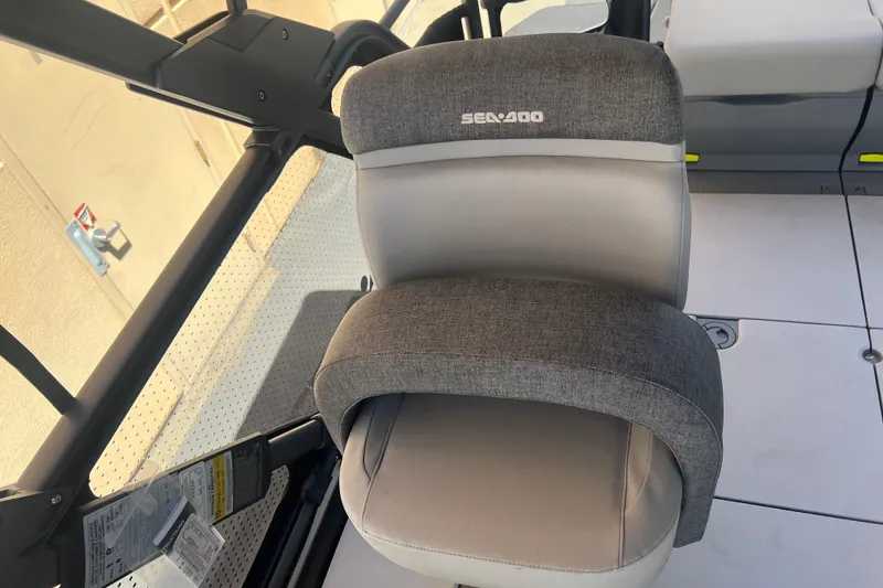 Slide: The Image of 2026 Sea-Doo Switch Cruise 21 boat seat, featuring gray upholstery and ergonomic design. - 14