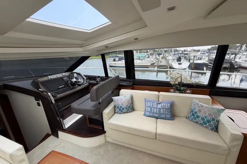 Slide: The Image of Luxurious interior of a 2012 Prestige 500S yacht with helm and comfortable seating. - 20