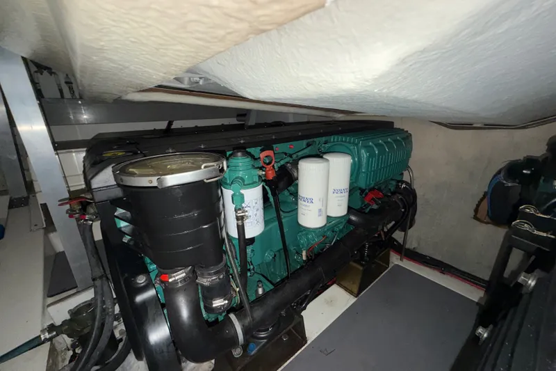 Slide: The Image of Engine room of a 2012 Prestige 500S yacht, featuring a Volvo Penta engine. - 94