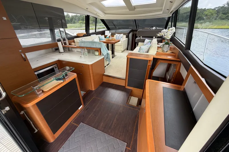 Slide: The Image of Luxurious interior of a 2012 Prestige 500S yacht with modern kitchen and seating area. - 11