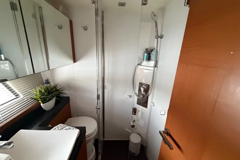 Slide: The Image of Modern bathroom in a 2012 Prestige 500S yacht, featuring a sleek shower and stylish sink. - 37