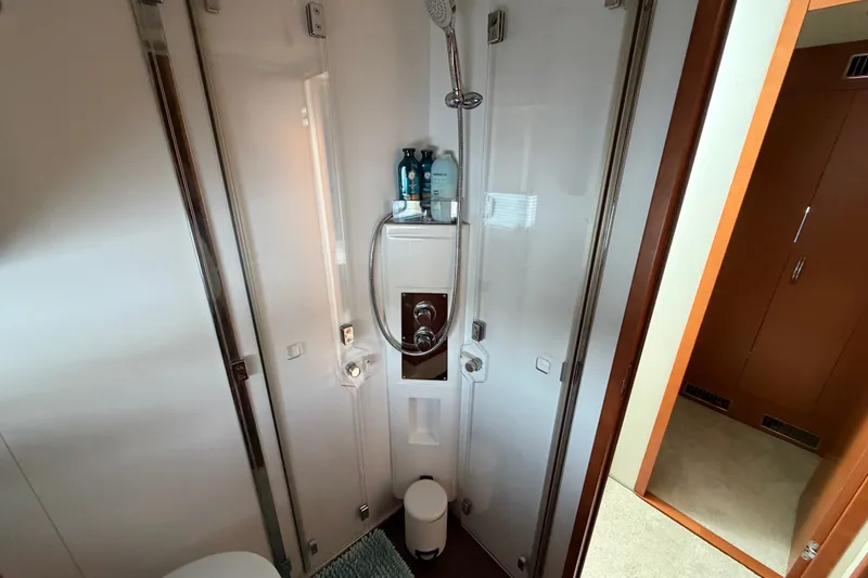 Slide: The Image of Compact bathroom in a 2012 Prestige 500S yacht, featuring a modern shower setup. - 35