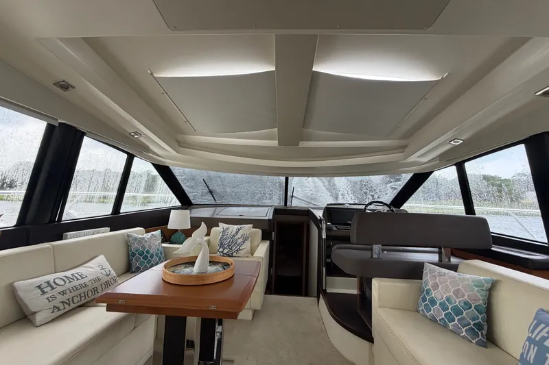 Slide: The Image of Luxurious interior of a 2012 Prestige 500S yacht with elegant seating and decor. - 68