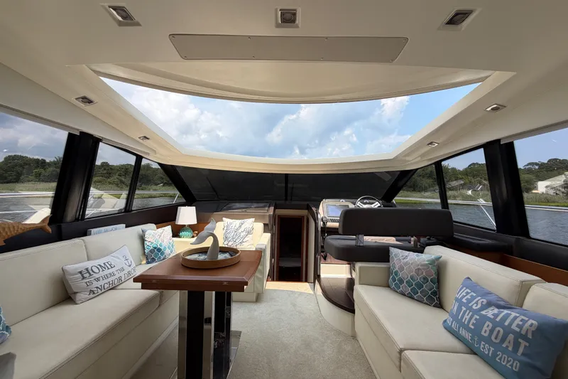 Slide: The Image of Luxurious interior of a 2012 Prestige 500S yacht with elegant seating and scenic views. - 25