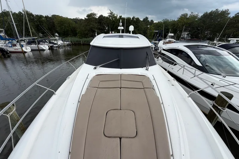 Slide: The Image of 2012 Prestige 500S yacht docked at marina, featuring sleek design and spacious deck. - 88